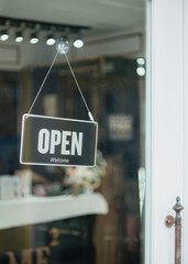 open sign hanging outside a restaurant, store, office or other