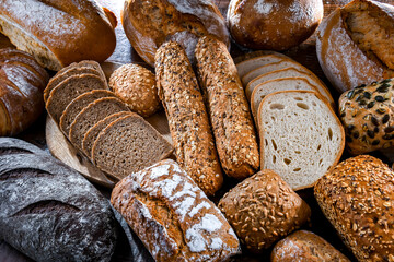 Assorted bakery products including loaves of bread and rolls