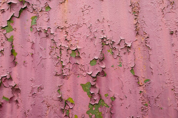 Close up shot of an old paint on the metal surface. Background