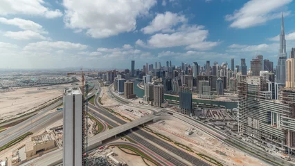 Foto op Canvas Panorama showing skyline of Dubai with business bay and downtown district. © neiezhmakov