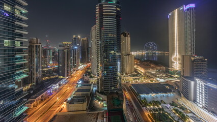 Fototapeta na wymiar Panoramic view of the Dubai Marina and JBR area and the famous Ferris Wheel aerial night