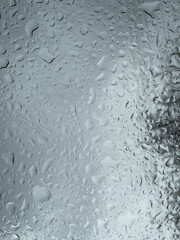 Raindrops on glass. A pattern of water droplets on a smooth surface.
