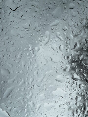 Raindrops on glass. A pattern of water droplets on a smooth surface.