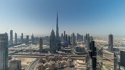 Fototapeta na wymiar Panorama showing aerial view of tallest towers in Dubai Downtown skyline and highway.