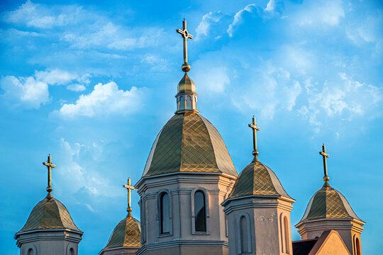 Domes with crosses of the Greek Catholic Church under the blue sky