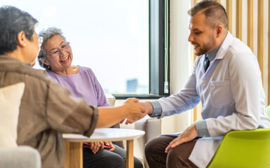 Man doctor with stethoscope service help support discussing and consulting care talk to sick senior asian woman patient in hospital,caregiver,elderly,recovery,illness insurance.healthcare and medicine