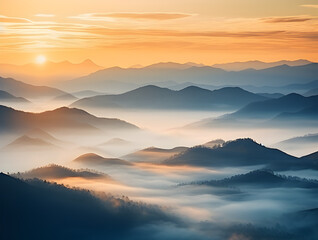 sunrise in the mountains over morning fog