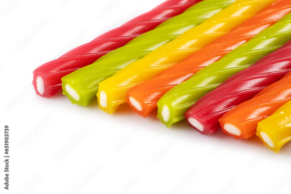 Sticker Multicolored jelly candies in the shape of the sticks on a white background