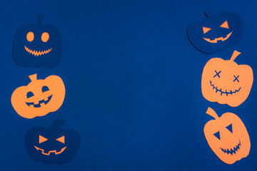 Happy Halloween, Pumpkin smile make from paper cut on dark blue background, Halloween concept