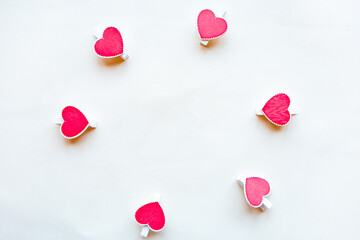 Red hearts on white background. Flat lay, top view, copy space. Valentine's Day greeting card