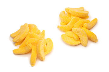 Juicy colorful jelly banana sweets isolated on white.