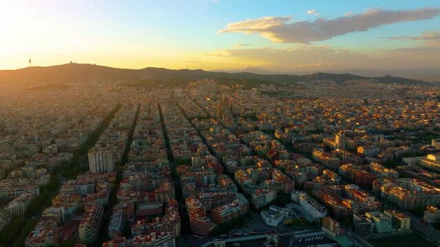 Aerial view of Barcelona Eixample district and Sagrada Familia Basilica, Spain. Barcelona street. Typical square quarters of Barcelona. Aerial view. Famous mediterranean destination in catalonia spain