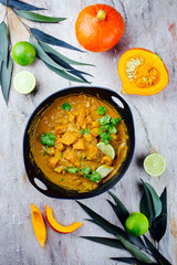 Traditional Indian vegetarian curry stew with sweet potatoes and as top view in saucepan 