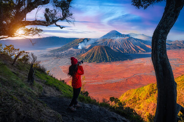 Travelers relax and enjoy the morning scenery at Mount Bromo. Located in Bromo, Tengger, Semeru National Park, East Java, Indonesia.