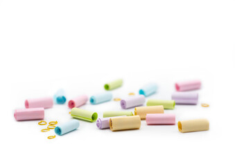 Colorful paper note with gold rings isolated on white background. A way to send special message to someone. spot focus and copy space