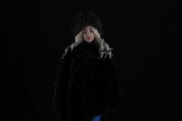 portrait of a beautiful asian blonde woman in a fur hat