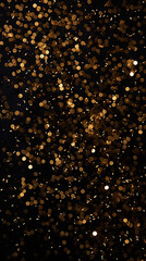 Gold sparkles, confetti on a black background. Vertical New Year background.