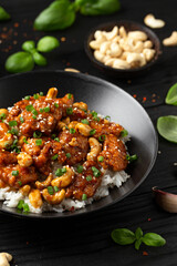 Crispy cashew Chicken stir fry with rice. Asian take away food