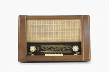 Authentic 60s radio receiver. Front view. On white background. Traces of time. isolated on white.