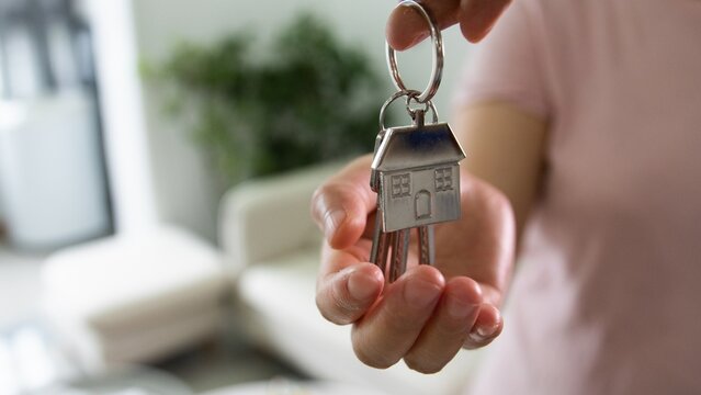 Giving keys to new house owner