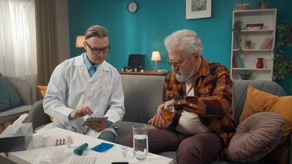 Full-size shot of a doctor checking up the condition of his patient at home. He is using a tablet and prescribing medicine to an eldery man with health issues.