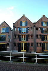 A row of dutch cheese warehouses from 19th century in Alkmaar, next to the canal