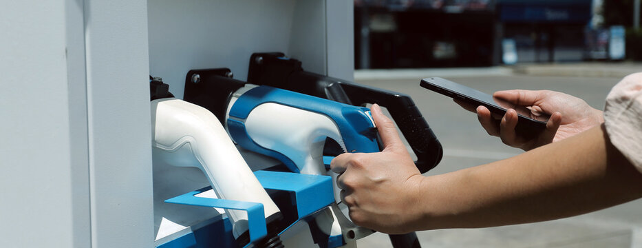 EV charging station for electric car in concept of green energy and eco power produced from sustainable source to supply to charger station in order to reduce CO2 emission .