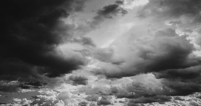 Black And White Colors Cloudy Sky Fluffy Clouds 4k Hyperlapse. Clouds Illuminated By Sun Move Rapidly Across Sky. Bw Bright Clouds Sky Moving In Dramatic Sky. Timelapse, Time Lapse, Time-lapse.