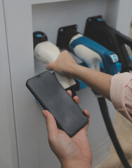 EV charging station for electric car in concept of green energy and eco power produced from sustainable source to supply to charger station in order to reduce CO2 emission .