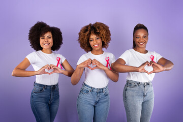 Black Ladies With Breast Cancer Ribbons Gesturing Heart Shape, Studio