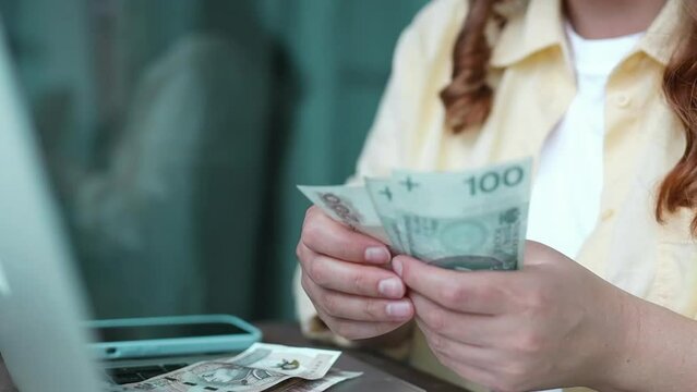 Successful businesswoman counting a lot of zloty money cash notes. Poland banknotes counting, financial, corruption, investment concepts, selective focus. High quality FullHD footage