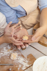Mom and daughter are engaged in baking. Natural. Pumpkin buns