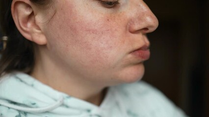 Beautiful woman eating burger in restaurant enjoying delicious juicy hamburger mouth watering meal. Close up. Slow motion.