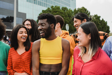 Multiracial people having fun together in the city - Diverse young friends - Community concept