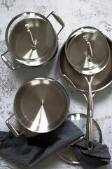Set of stainless pots with lids