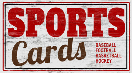 Aged and worn sports cards sign on wood