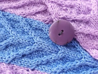 blue knitted fabric with needles