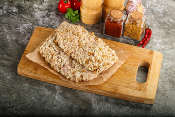 Breaded raw breaded meat schnitzel