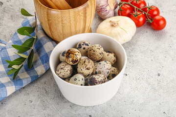 Raw quail eggs in the bowl