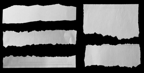Torn papers on black