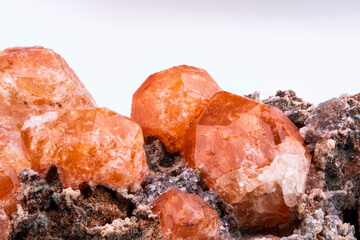Analcime orange crystal macro detail texture background. close-up raw rough unpolished semi-precious gemstone