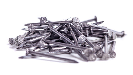 Pile of small grey metal nails isolated on white background. Close-up - Powered by Adobe