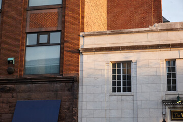 Windows on a classic brick building. Exterior photograph.