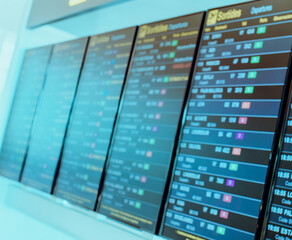 Departure boards at airport, abstract out of focus background