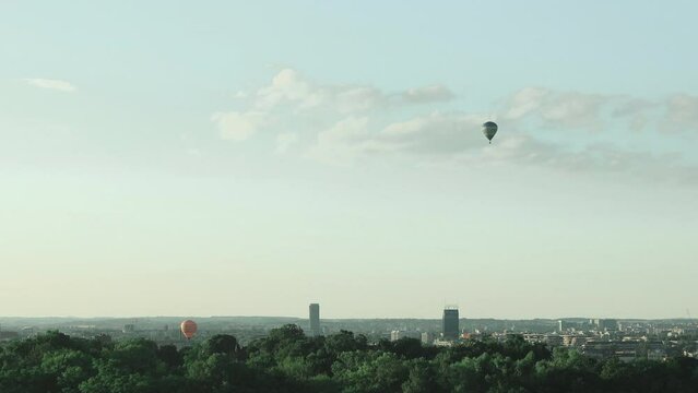 Colorful hot air balloons flying over the city. Krakow, Poland. High quality FullHD footage