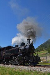 Fototapeta na wymiar Die historische Dampfbahn Furka Bergstrecke beim Start in Oberwald VS, Schweiz