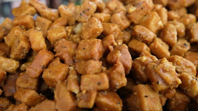 Sweet kotkoti, a popular Filipino and Indian dessert. Kotkoti is a type of rice cake made with coconut milk and brown sugar. It is typically steamed and served with grated coconut.