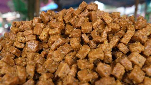 Sweet kotkoti, a popular Filipino and Indian dessert. Kotkoti is a type of rice cake made with coconut milk and brown sugar. It is typically steamed and served with grated coconut.