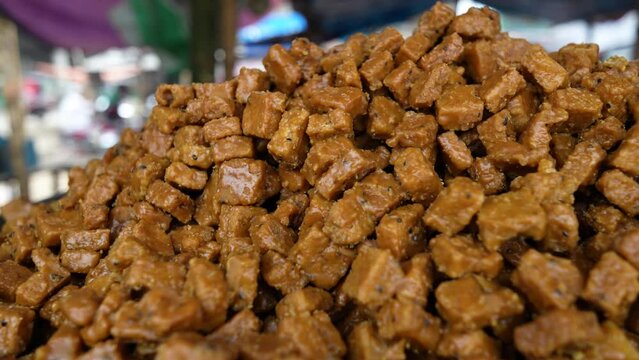 Sweet kotkoti, a popular Filipino and Indian dessert. Kotkoti is a type of rice cake made with coconut milk and brown sugar. It is typically steamed and served with grated coconut.