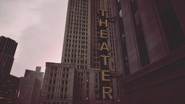 A tall building with a sign that reads the theatre